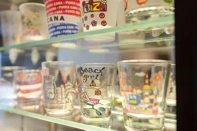 a group of glasses on a shelf in a store at Stunning Modern 1BD Apartment in Barranco in Lima