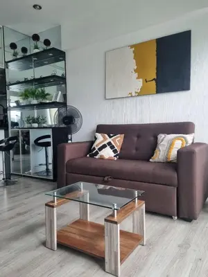 a living room with a brown couch and a glass coffee table at Big Apartment 2 rooms next to Miraflores in Lima