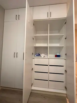 a closet with white cabinets and white shelves at Big Apartment 2 rooms next to Miraflores in Lima