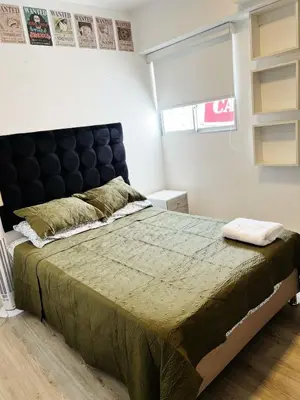 a bedroom with a large bed and a window at Big Apartment 2 rooms next to Miraflores in Lima