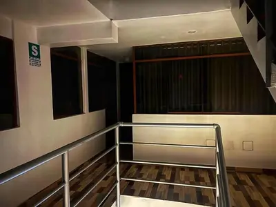an empty room with a staircase in a building at TAYWA HOTEL in Machu Picchu