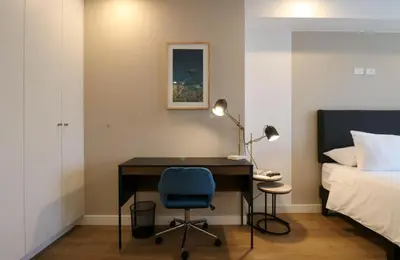 a bedroom with a desk and a bed and a bed at Sky Balta in Miraflores by Wynwood House in Lima