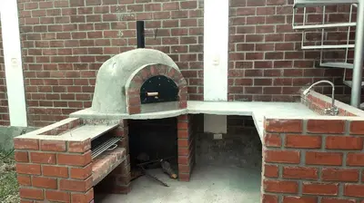 a brick oven in the side of a brick building at El Valle - Lunahuaná in Lunahuaná