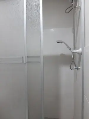 a shower with a glass door in a bathroom at El Valle - Lunahuaná in Lunahuaná