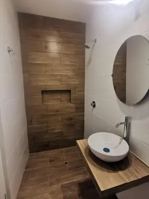 a bathroom with a sink and a mirror at Hotel Sol de Marcona in San Juan de Marcona