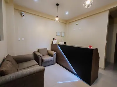 a lobby with two chairs and a counter in a room at Hotel Sol de Marcona in San Juan de Marcona