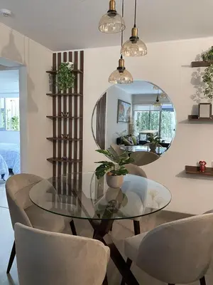 a dining room with a glass table and chairs at Silvia's New Spacious Patio Pad in Lima