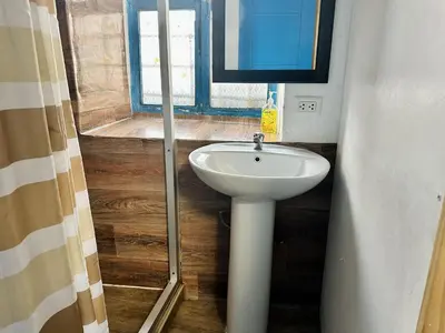 a bathroom with a sink and a window at AITANA'S HOUSE - SAN BLAs in Cusco