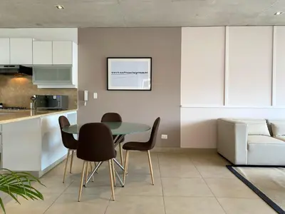 a kitchen and dining room with a table and chairs at Modern Penthouse & 2BR in Miraflores by Wynwood House in Lima