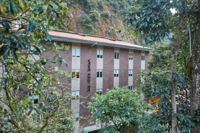 a large building with trees in front of it at Casa Andina Standard Machu Picchu in Machu Picchu