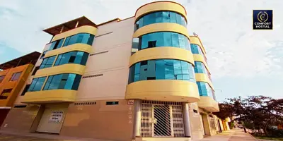 a building with a blue and yellow building at Hospedaje Comfort Lima in Lima