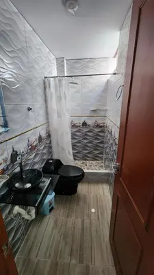 a small bathroom with a toilet and a sink at TRANSFER VIP HOSTEL in Lima