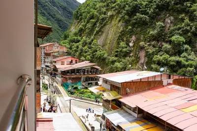 a view of a town with a mountain at Rockrivers Plaza MachuPicchu in Machu Picchu