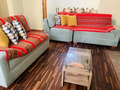 a living room with two couches and a coffee table at Peruvian House - Miraflores in Lima