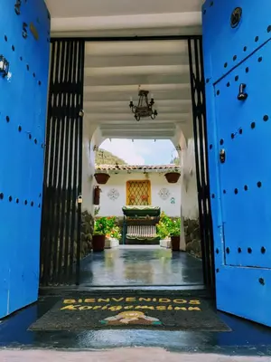 an entrance to a house with blue doors at Kori Gems Inn in Cusco