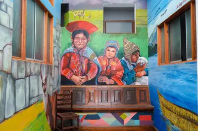 a mural of a family on the side of a train at Yaki Hostel in Lima