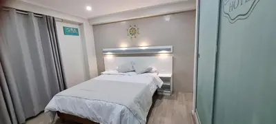 a small bedroom with a bed and a window at EL FARO HOTEL in Chala