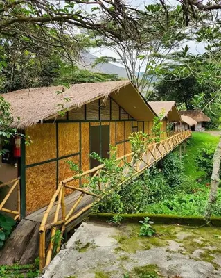 a small building with a bridge in front of it at Araplay Lodge in Santa Teresa