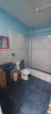 a bathroom with a toilet and a sink at Hospedaje D'LEYDI in Lima