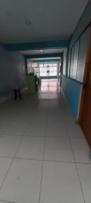 an empty hallway of a building with a bench in it at Hospedaje D'LEYDI in Lima