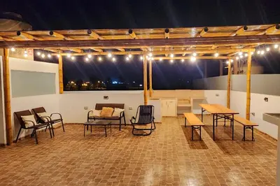 a large room with tables and chairs and lights at Casa de Playa en Cerro Azul in Cerro Azul