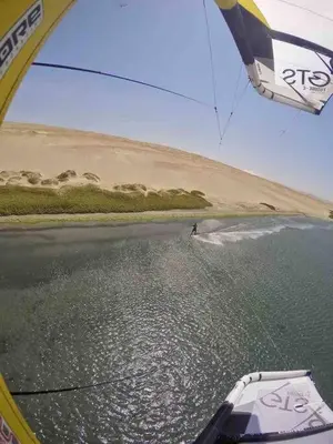 a kite being flown over a body of water at 3BR Paracas Kite Gym Work Oasis in Santo Domingo