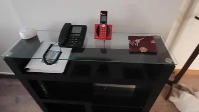 a glass table with a cell phone on top of it at New! Modern 4BR Apartment Miraflores Lima in Lima