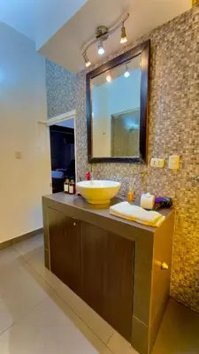 a bathroom with a bowl sink and a mirror at Andean Palace Boutique in Cusco