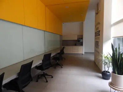 an office with desks and chairs in a room at Loft de estreno, San Borja, muy centrico in Lima