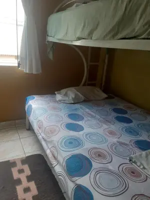 a bed in a room with a bunk bed at ALAVA 245 in Lima