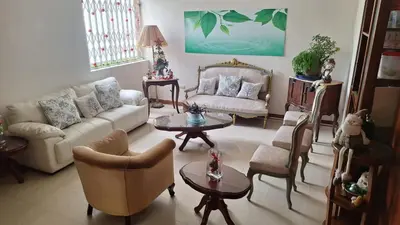 a living room with a couch and chairs and a table at Adri s House in Lima