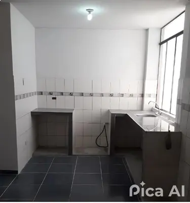 a small kitchen with a sink and a sinkessment at Peruvian Apartment in Lima