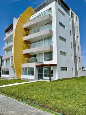 a large white building with a large circle on it at 1er Piso Vista a Bahía Paracas - Las Velas 102 T1 in Paracas