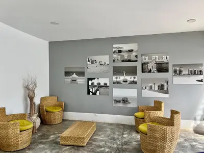 a room with chairs and pictures on the wall at 1er Piso Vista a Bahía Paracas - Las Velas 102 T1 in Paracas