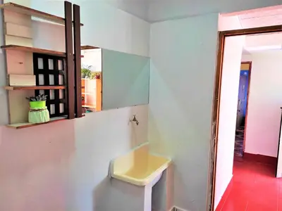 a bathroom with a yellow sink in a room at APARTAMENTO VISTA IMPERIAL II Mirador Panoramico in Cusco