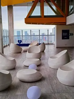 a room with white seats on the floor of a building at Audacity Moderno Departamento in Lima
