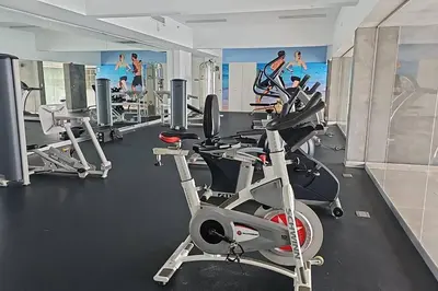 a gym with several treadmills and cardio machines at Departamento de Playa San Bartolo SOL ARENA & MAR in San Bartolo