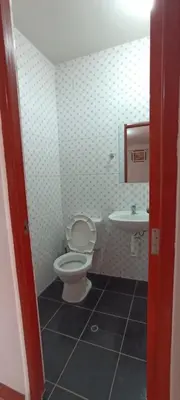 a bathroom with a toilet and a sink at Casa Tejedora in Chinchero