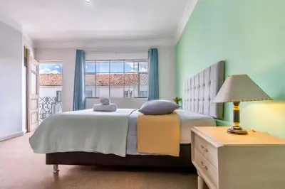 a bedroom with a large bed and a window at Templo de la Luna in Cusco
