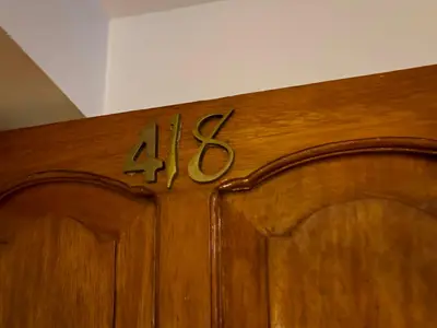 a wooden cabinet with the number on it at Santuario Machupicchu in Machu Picchu
