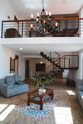 a living room with a couch and a table at Hermosa casa en Valle Sagrado in Cusco
