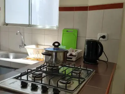 a pot sitting on top of a stove in a kitchen at LA CASA DE LA ABUELA in Barranca