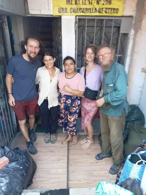 a group of people posing for a picture at POSADA ISABELITA in Lima