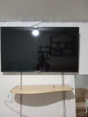 a flat screen tv hanging on a wall at POSADA ISABELITA in Lima