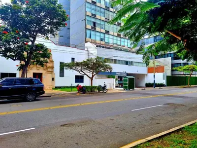 a street with a car parked in front of a building at San Isidro Suites Basadre 1B403 in Lima