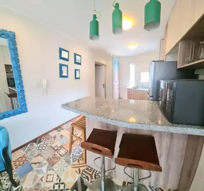 a kitchen with a counter and a counter top at San Isidro Suites Basadre 1B403 in Lima