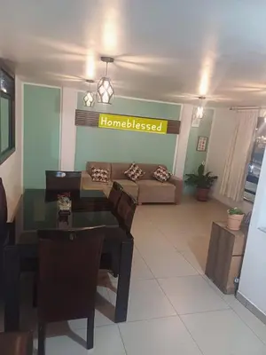 a living room with a couch and a table at HOME BLESSED II in Lima