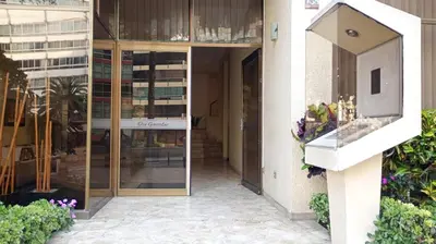 a facade of a building with a glass door at APARTAMENTO COMPLETO EN LA MEJOR ZONA DE MIRAFLORES in Lima