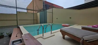a swimming pool on top of a building at APARTAMENTO COMPLETO EN LA MEJOR ZONA DE MIRAFLORES in Lima