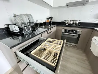 a kitchen with an open drawer in the middle at Departamento amoblado in Lima